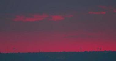 Beautiful sunset time lapse above the Wind turbines on sea coast, HDR RAW shots