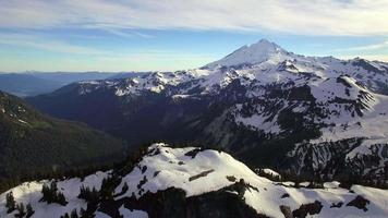 Epic Helicopter View of Snowy Cascade Mountain Range with Mt Baker in Distance video