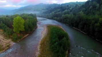 Aerial view of the mountain river in Carpathians on sunrise video
