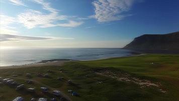 Flying over campsite and picturesque village Flakstad on Lofoten video