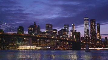 View of Brooklyn Bridge with the distinctive New York skyline at sunset video