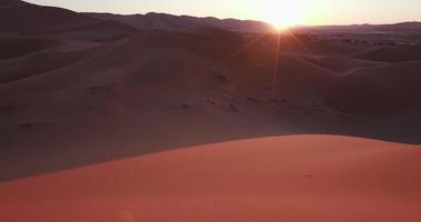 4K panning shot of sun rising over the sand dunes inside the Namib-Naukluft National Park video