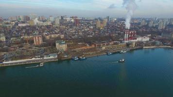 Modern aerial cityscape with a thermal power plant and river. video