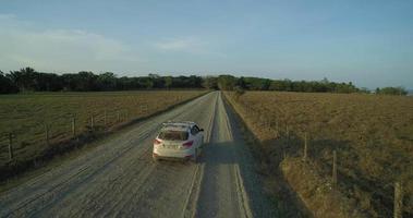 Aerial view of a car travelling down a country road - Puerto Jiménez, Costa Rica video