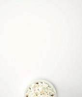 Top view of popcorn on a white surface