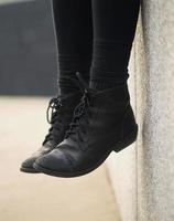 Close-up of black lace-up boots photo