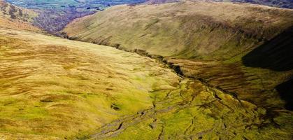 Green and brown valley during the day photo