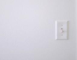 White wall with a light switch photo