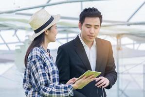 Woman and man discussing photo