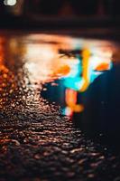 Lights reflected in a puddle photo