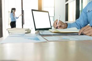 Businessman working with computer on table photo