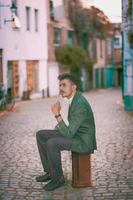 Man sitting in suitcase  photo