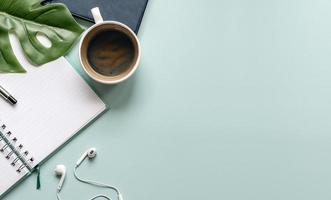 Top view of a workspace on a blue desk photo