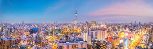 View of downtown Tokyo skyline at sunset photo