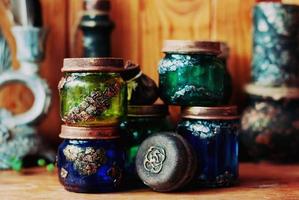 Magical colorful jars, witchy Halloween decor photo