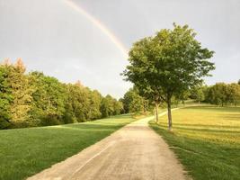 Rainbow over the summer landscape photo