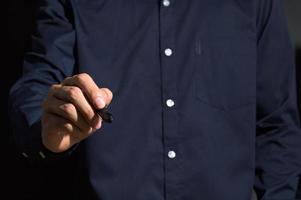 A business man using a pen photo