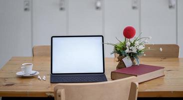 Laptop mockup on a dining room table