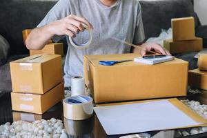 Close-up of a person preparing shipments from home photo