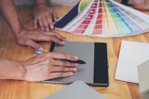 Close-up of a designer using a drawing tablet photo