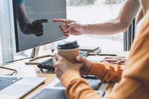 Two professionals working on code photo