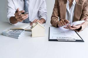 Two people going over real estate contract photo