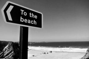 Grayscale photo of beach signage