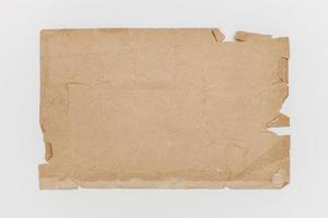 Worn brown paper on a white background photo