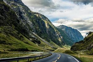 Gray asphalt road between mountains photo