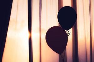 Silhouette of two balloons  photo