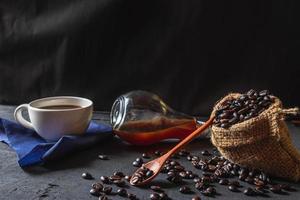 Hot coffee and raw coffee beans  photo