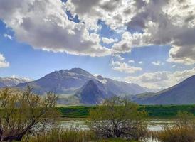 Kashantu village near river and mountains photo