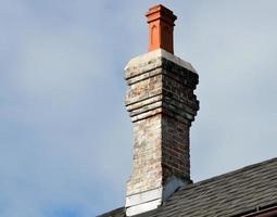 Vintage chimney on a roof photo
