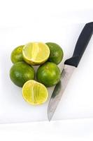 Limes on the white background photo