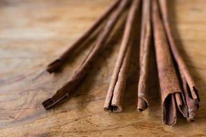 Cinnamon Sticks on Wooden Background