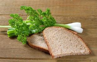 Black bread with green onions photo