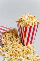 Full popcorn in classic popcorn box photo