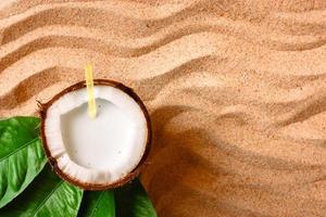 coconut on the sand beach photo