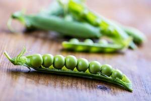 Fresh Homemade Peas On The Wooden Background. photo