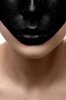 Closeup beauty dark face with black lips