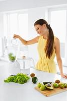 Healthy Diet. Woman Making Detox Smoothie Juice. Vegetarian Eating