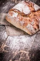 Fresh bread on wooden table photo