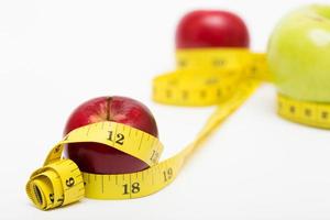 red apple and measuring tape photo