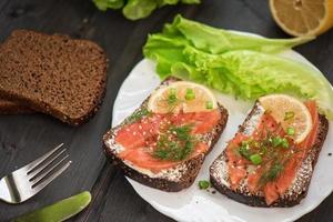Sandwich with salmon for breakfast photo