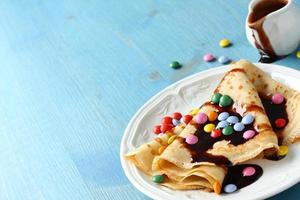 Homemade crepes with multicolored dragee