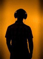 Silhouette of man with headset