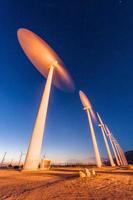 Wind Turbines in desert during sunrise time photo