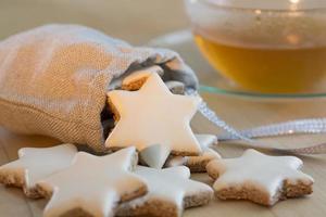 Cinnamon stars christmas cookies and tea cup photo