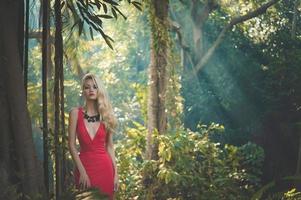Beautiful lady in tropical forest photo