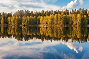 autumnal lake near the forest photo